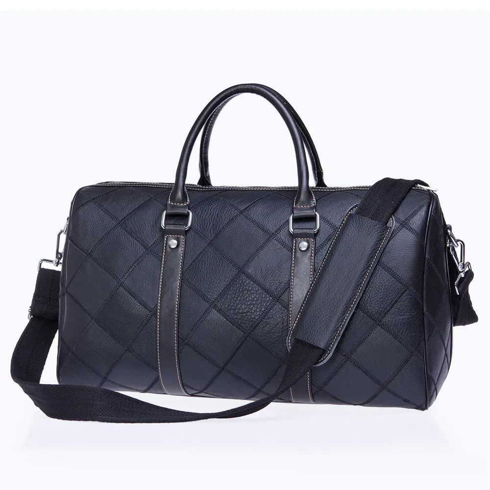 Vintage checked men's leather duffel bag with a single shoulder strap, shown in a light coffee colour.