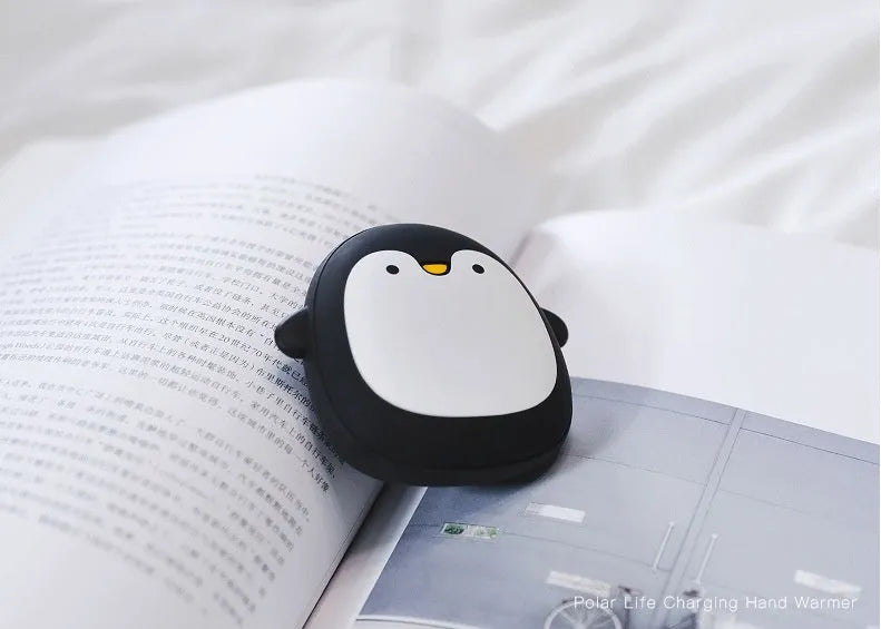 Cartoon penguin and polar bear design USB rechargeable hand warmer showing front and back.