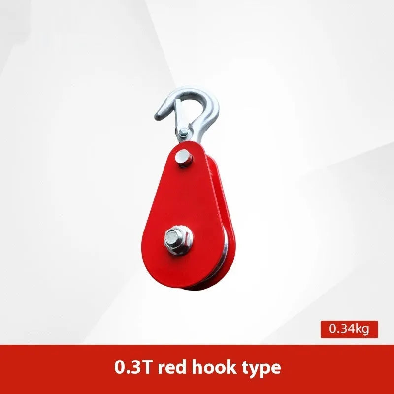 Red industrial steel lifting pulley with a safety latch on the hook for secure lifting.