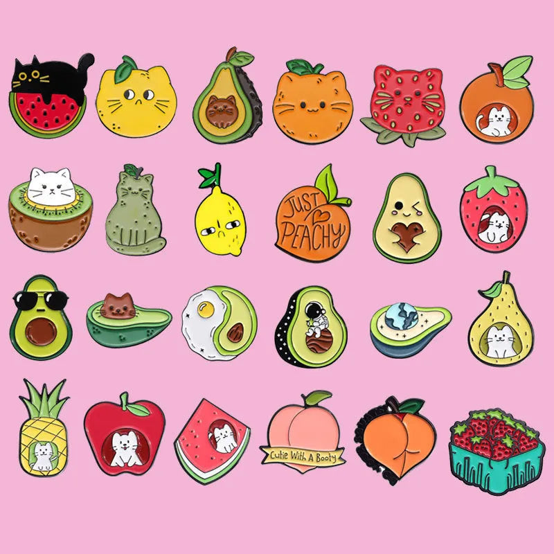 Colourful cartoon-style fruit metal brooch with pin back on a denim jacket lapel.