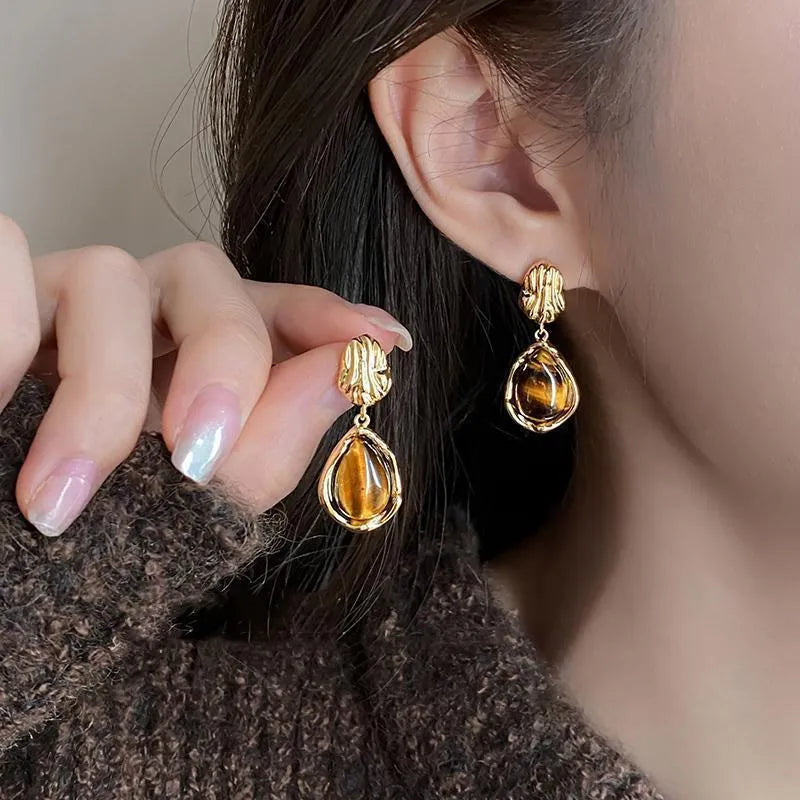 Three pairs of handmade geometric alloy earrings with electroplated finishes and tassel details
