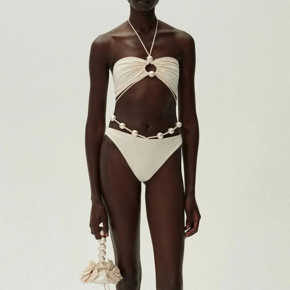 Black women's two-piece bikini swimsuit with lace-up front detail on the top.