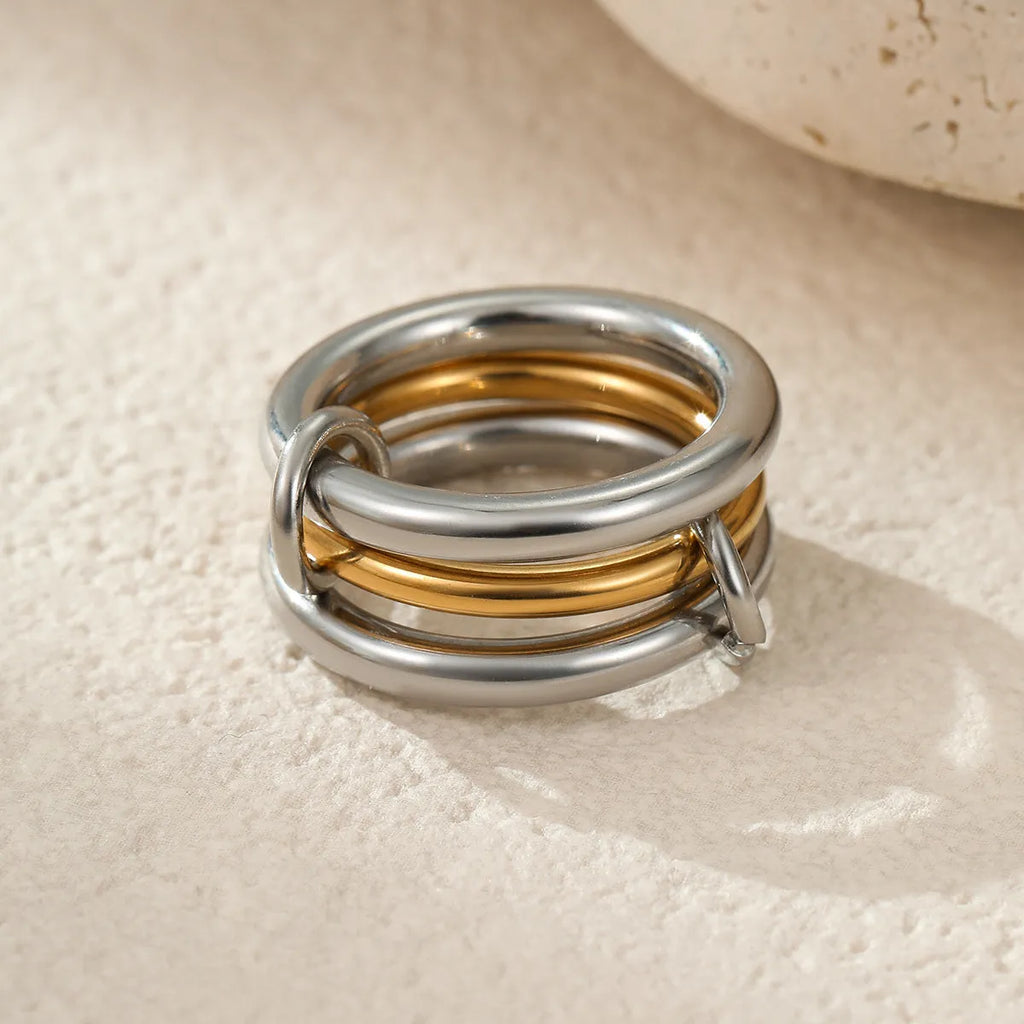 A stacked stainless steel ring set with 18K gold plating in an exaggerated design for women.