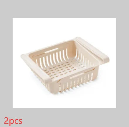 Blue telescopic plastic storage basket for refrigerator organisation with fruits and vegetables inside.