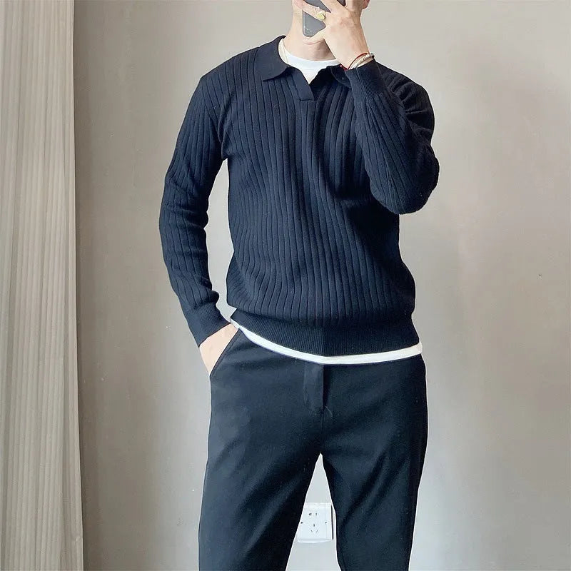 Man wearing a loose grey modal knit pullover sweater with a textured rabbit fur blend fabric.