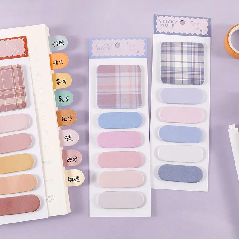 Set of six colourful plaid design sticky note pads, each sized 67mm by 200mm.