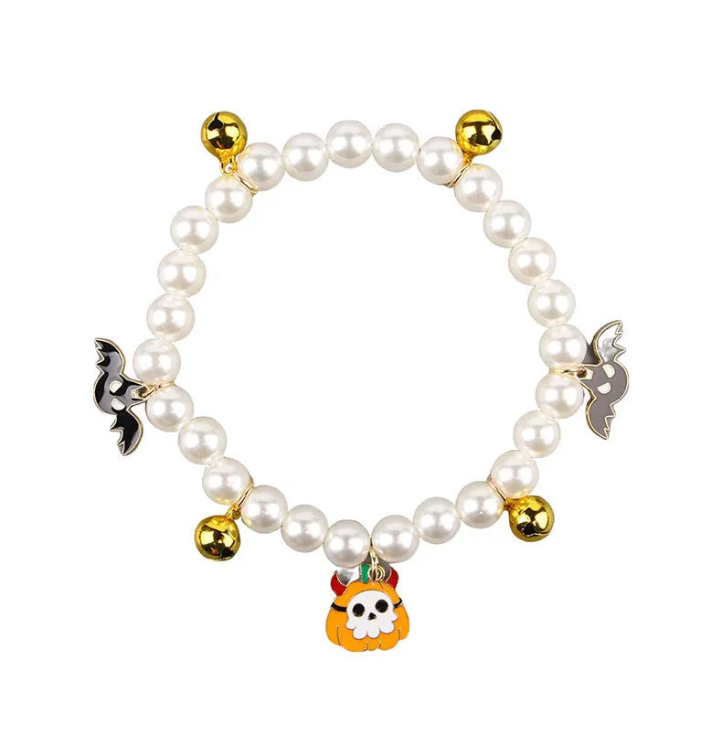 Halloween cat collar decorated with simulated pearls in a pumpkin design on a pet