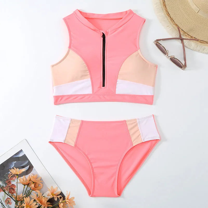 Pink high waist split bikini swimsuit set on a model, showing the brief style and sleeveless top.