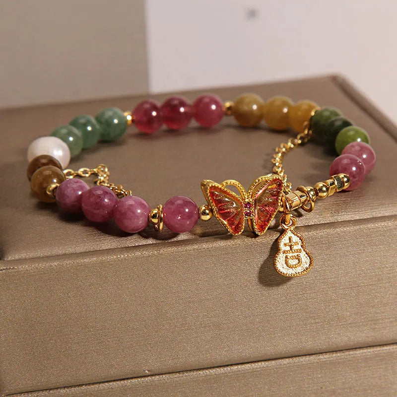 Natural jade coloured tourmaline butterfly agate bracelet for women showing pendant detail