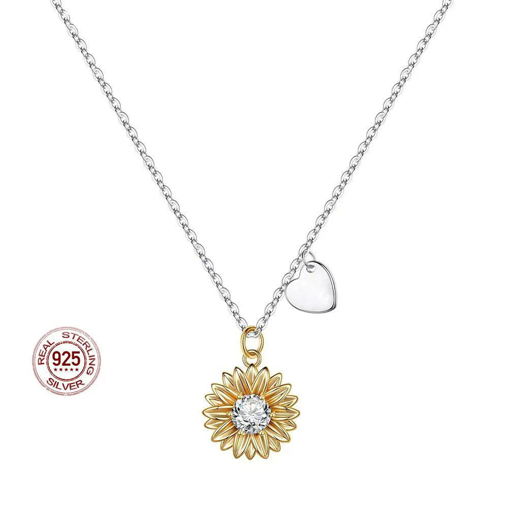 Close-up of a geometric daisy pendant necklace on a silver cross chain, adjustable from 21cm to 50cm.