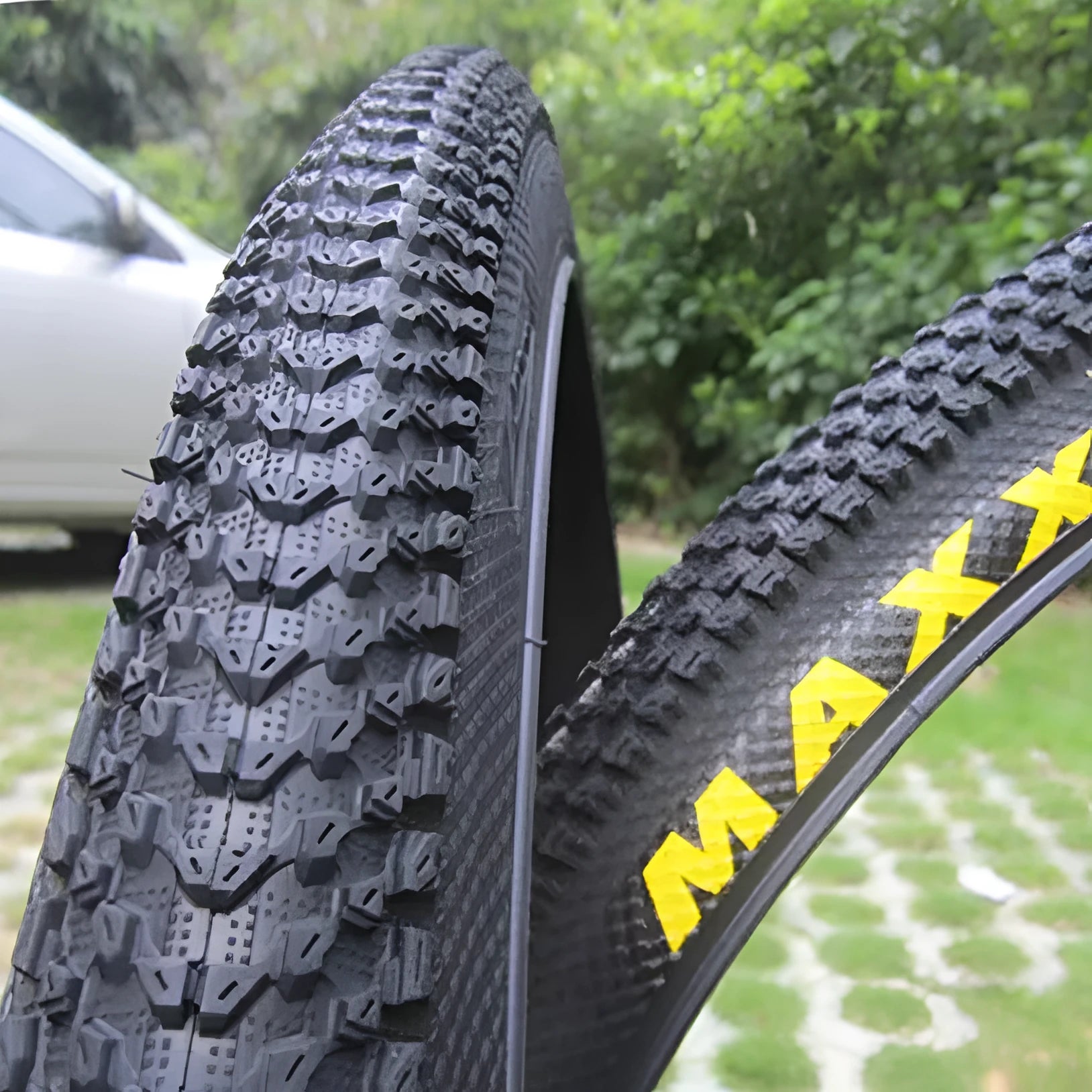 Ultralight black mountain bike tyre with white label option, showing tread pattern and size markings.