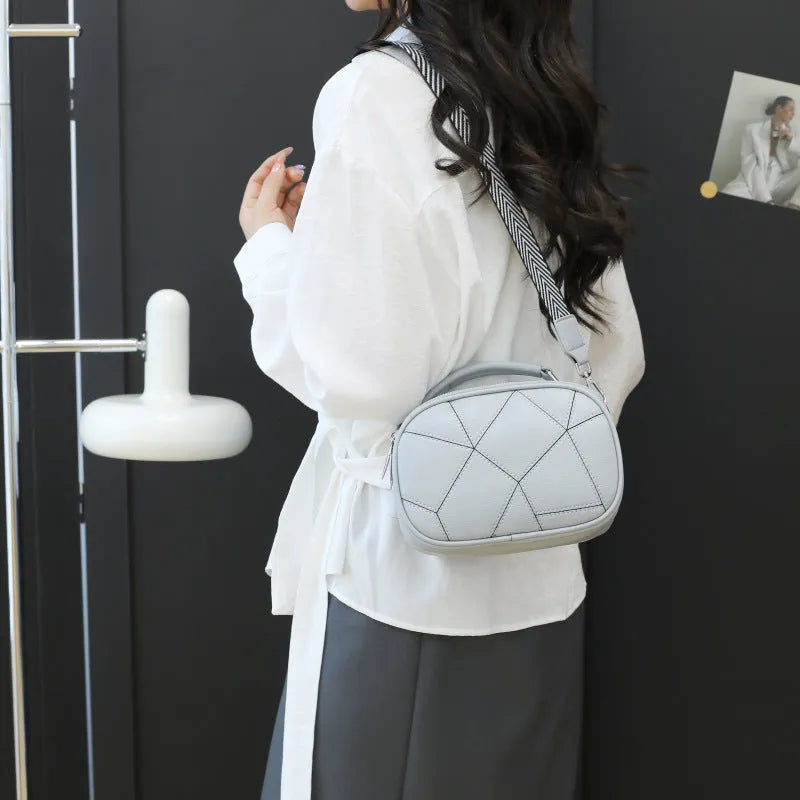 Round grey retro patchwork PU leather crossbody bag with stitching details