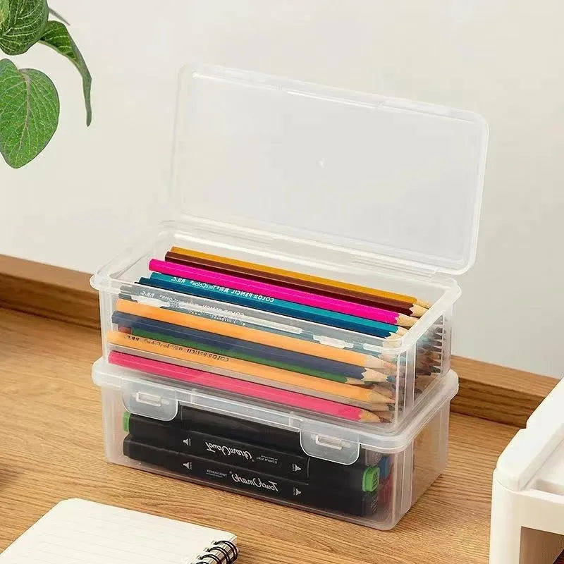 Large transparent pencil storage box with compartments for organising coloured pencils and drawing materials