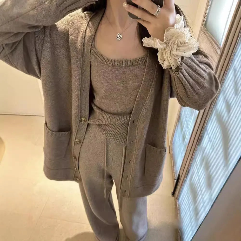 Women's knit three-piece set with cardigan, vest, and suspender pants in wool blend fabric