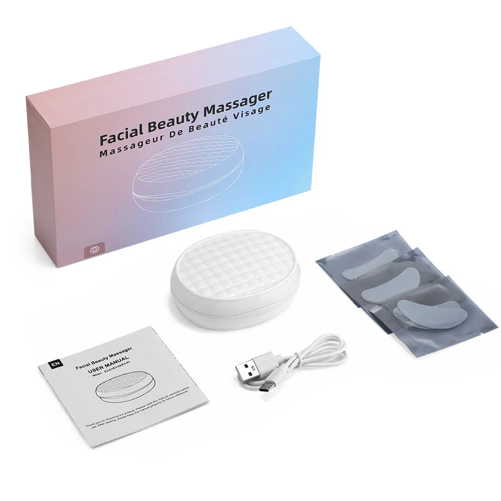 White wireless red light and EMS electric eye and facial massager device for home use.