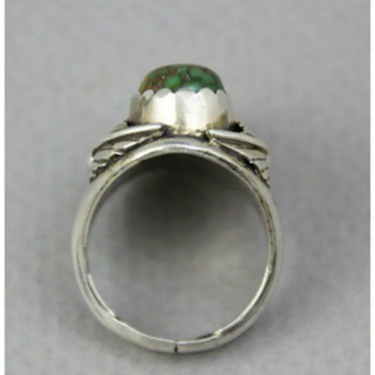 Retro geometric women's ring with a turquoise colour inlay on a silver-toned electroplated alloy band.