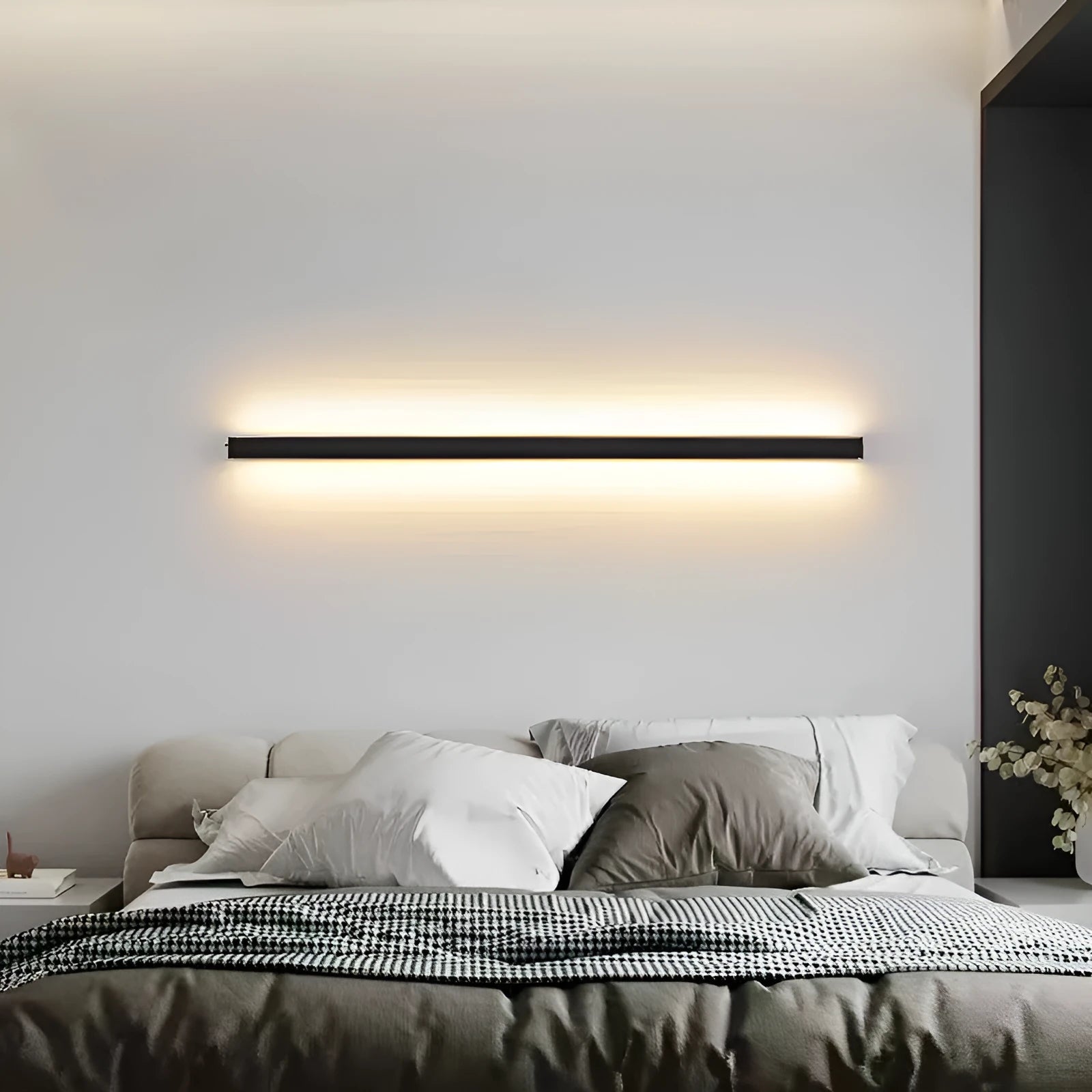 Black 80cm long simple strip LED wall lamp mounted on a plain wall.