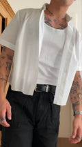 Men's plain white short sleeve polyester shirt with a regular fit and cropped top length.