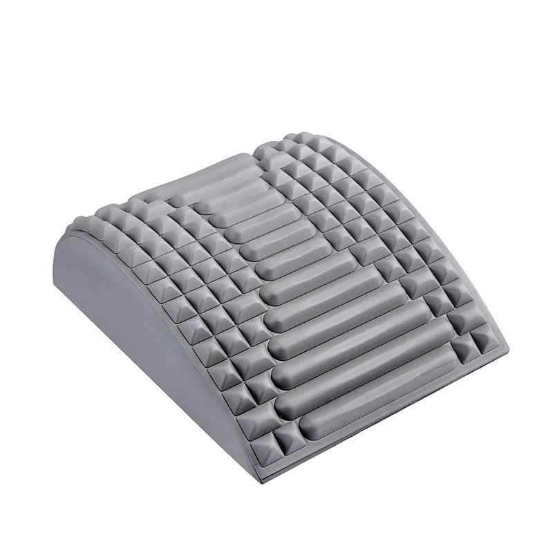 Blue back stretcher pillow for lumbar and neck support on a grey background.