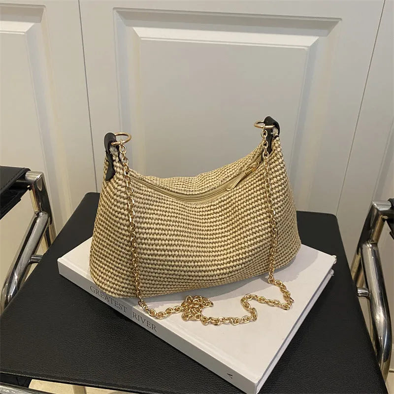 Woven straw crossbody handbag with horizontal square shape and phone compartment