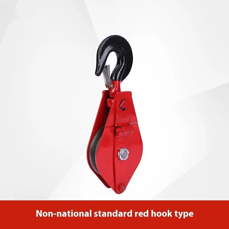 Red industrial steel lifting pulley with a safety latch on the hook for secure lifting.