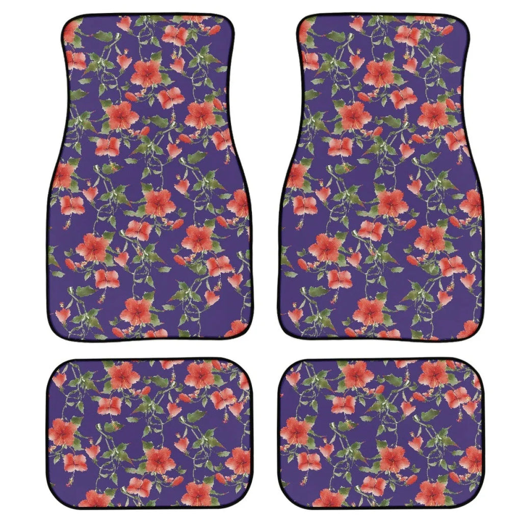 Set of four black printed rubber car floor mats with textured surface, shown on a car's footwell.