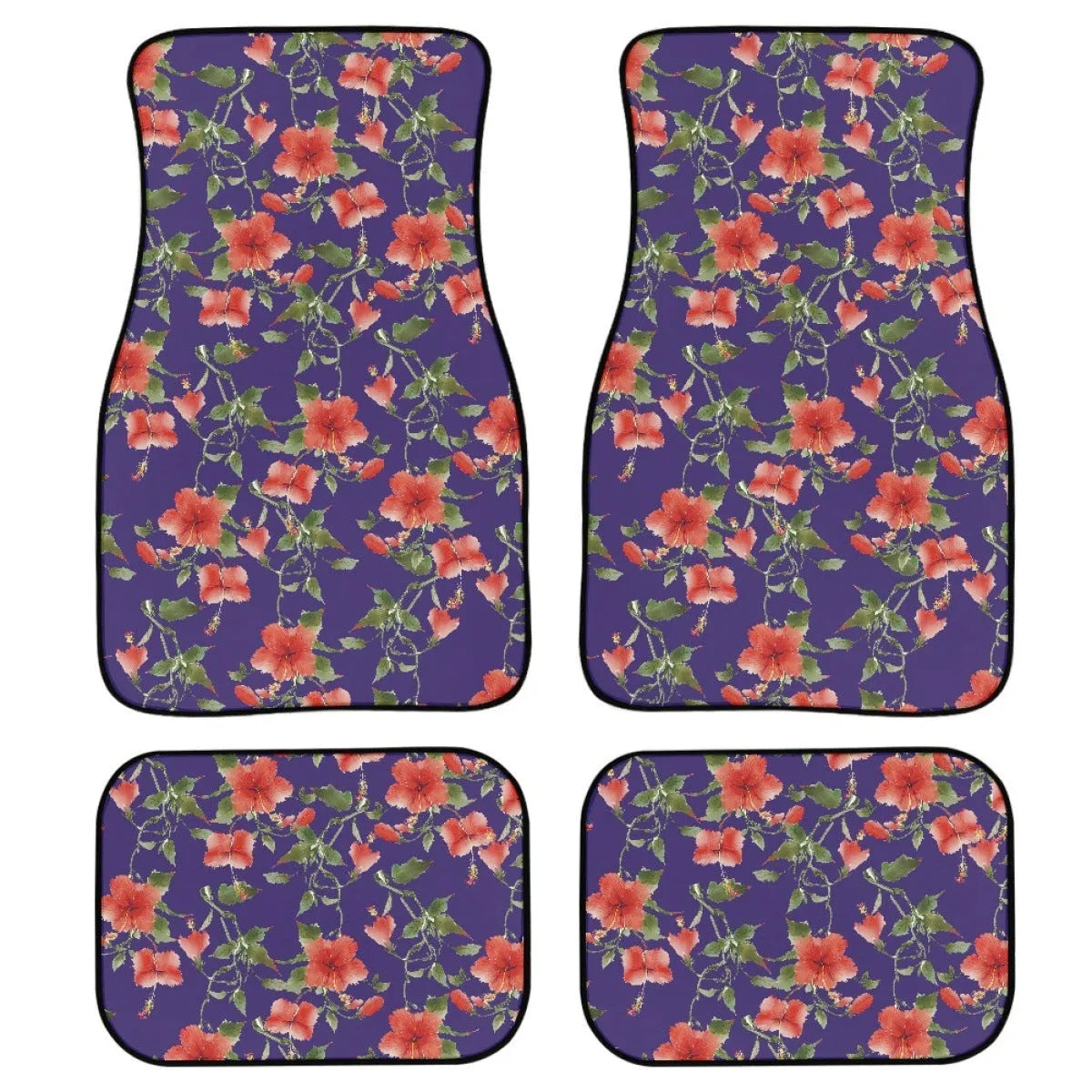 Set of four black printed rubber car floor mats with textured surface, shown on a car's footwell.
