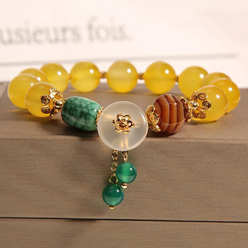 Women's yellow agate crystal bracelet on gold silk cord in khaki colour