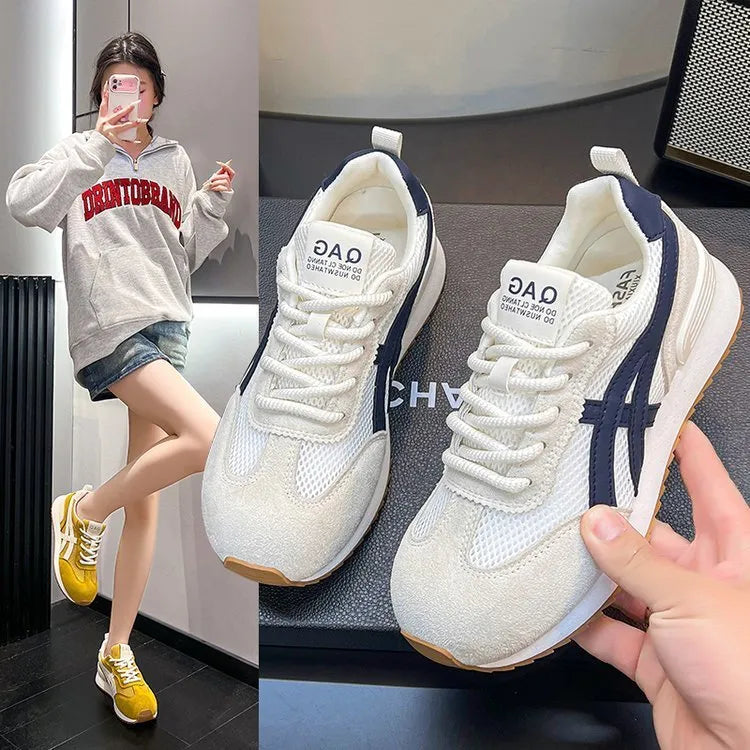 Women's white casual lace-up sneaker with non-slip sole on neutral background