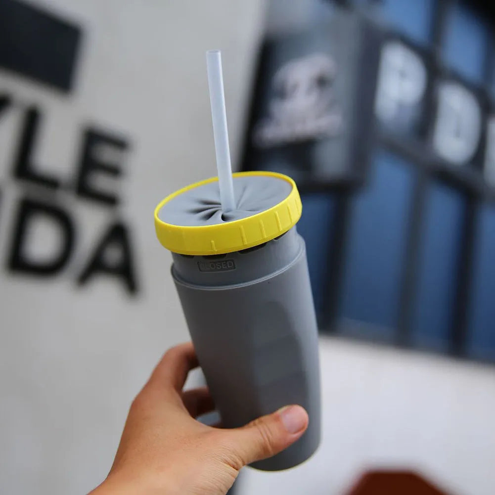 Double wall insulated travel tumbler with twist seal showing cartoon patterns and straw