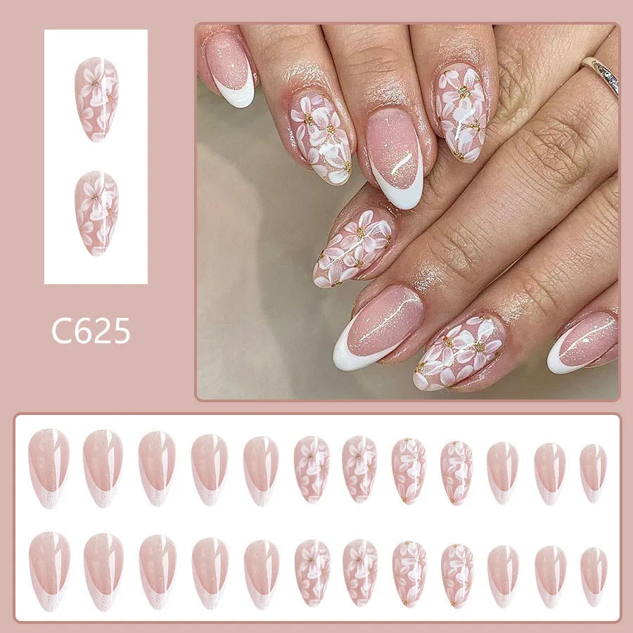 Short glossy almond French style false nails with glittering flower pattern in colour C625