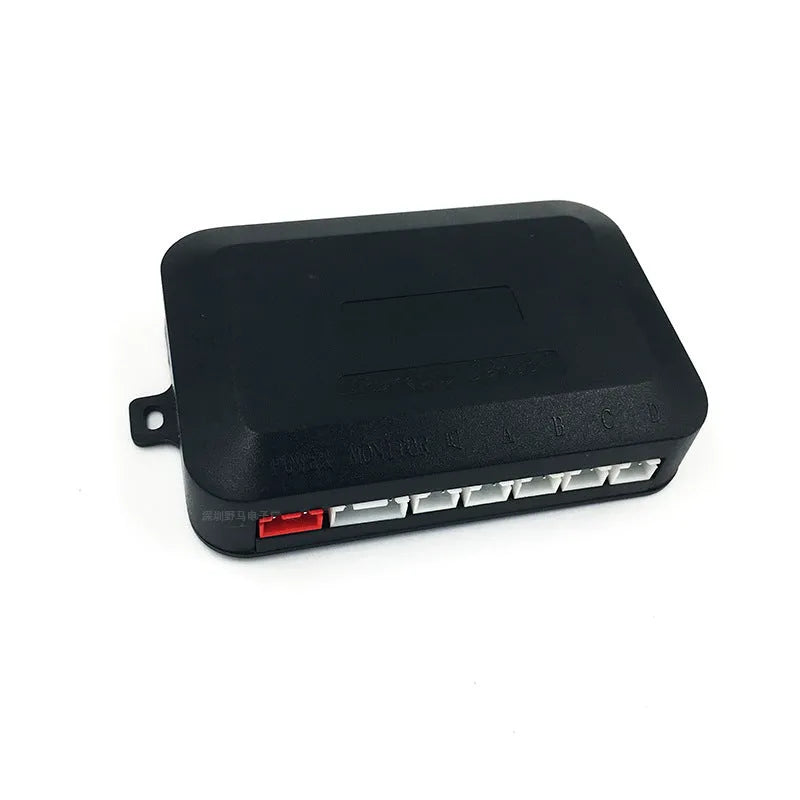 4-probe buzzer-only car reversing radar kit with sensors, control module, and hole saw on a grey background.