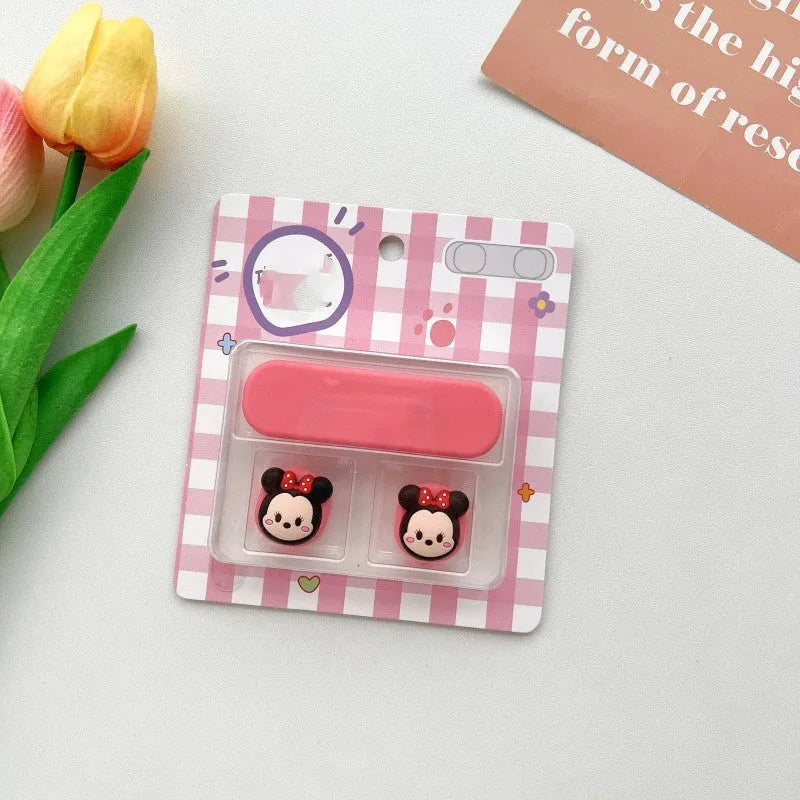 Plastic cartoon-style magnetic data cable fixer clip on a desktop