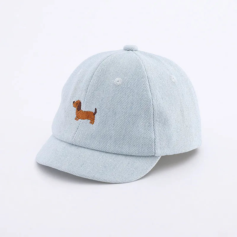 Baby denim baseball cap with puppy patch in light blue, dark blue, and black colour options.