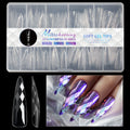 Pack of 3D diamond-patterned long artificial nail tips on a black background.