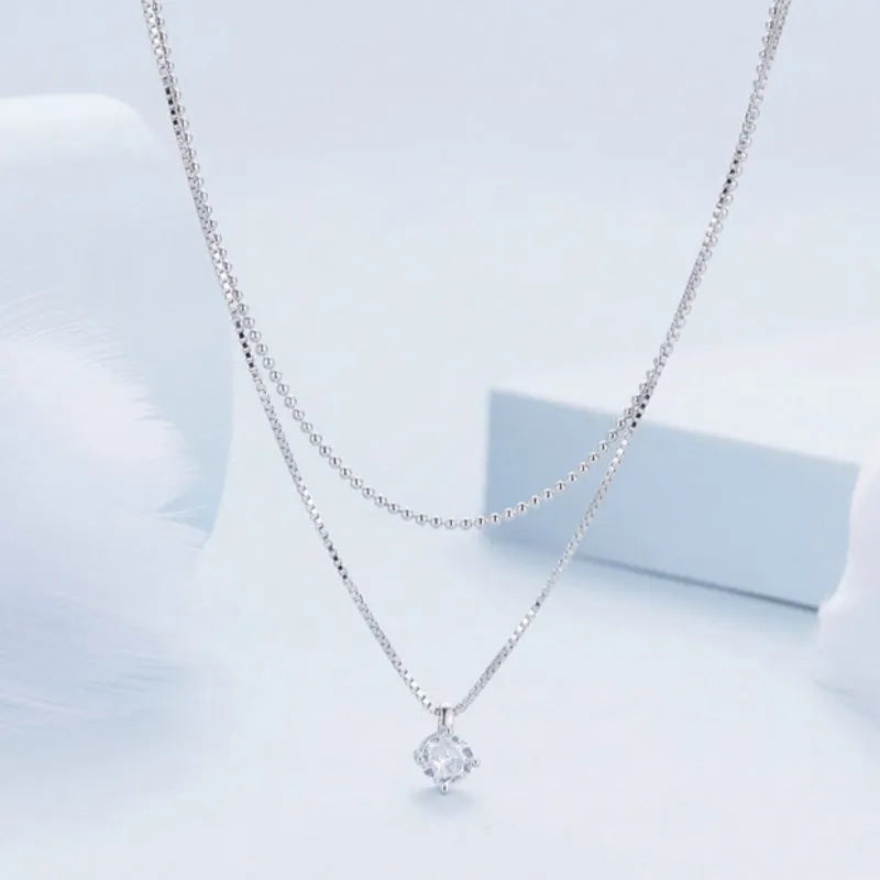 Sterling silver double-layer necklace with pearl chain design and pendant