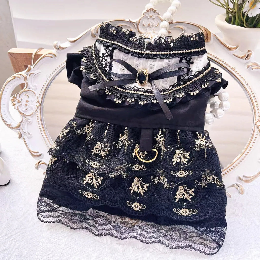 Golden layered gothic-style skirt for a small dog or cat on a mannequin, showing princess cut.