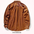 Loose fit caramel corduroy long sleeve shirt with a cardigan style on a hanger.