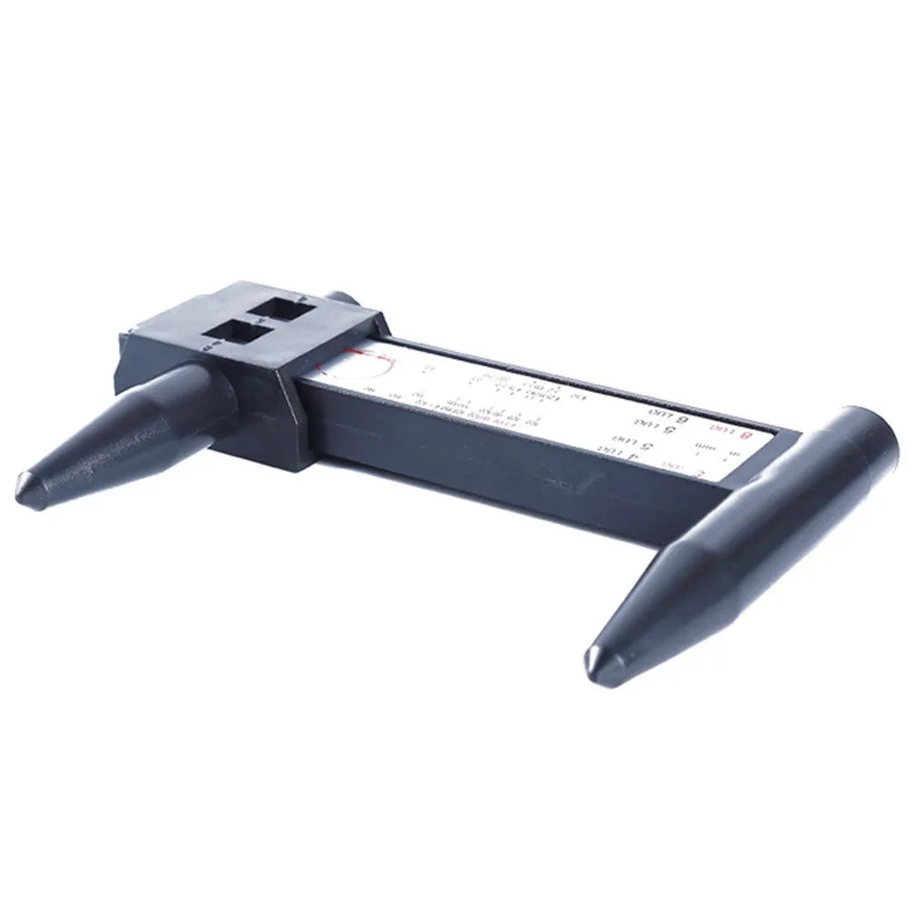 Plastic digital hole distance measuring ruler for wheel hub bolt patterns, showing digital display.