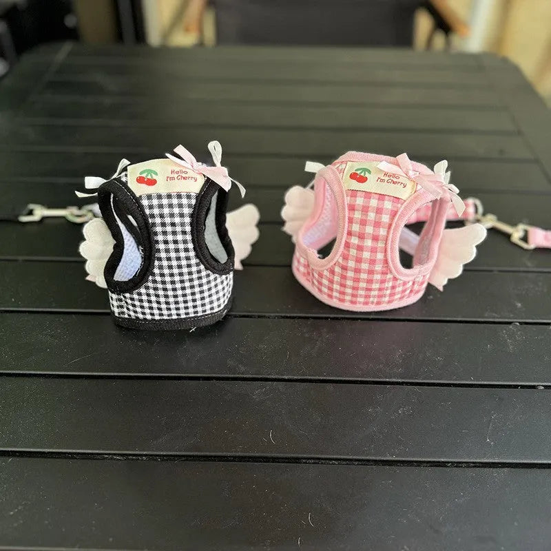 Pink and black cotton chest-back hand holding rope harness for small dogs.