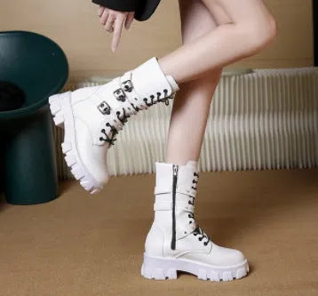 Black women's mid-calf knight boots with metal buckle detail and side zip on a white background