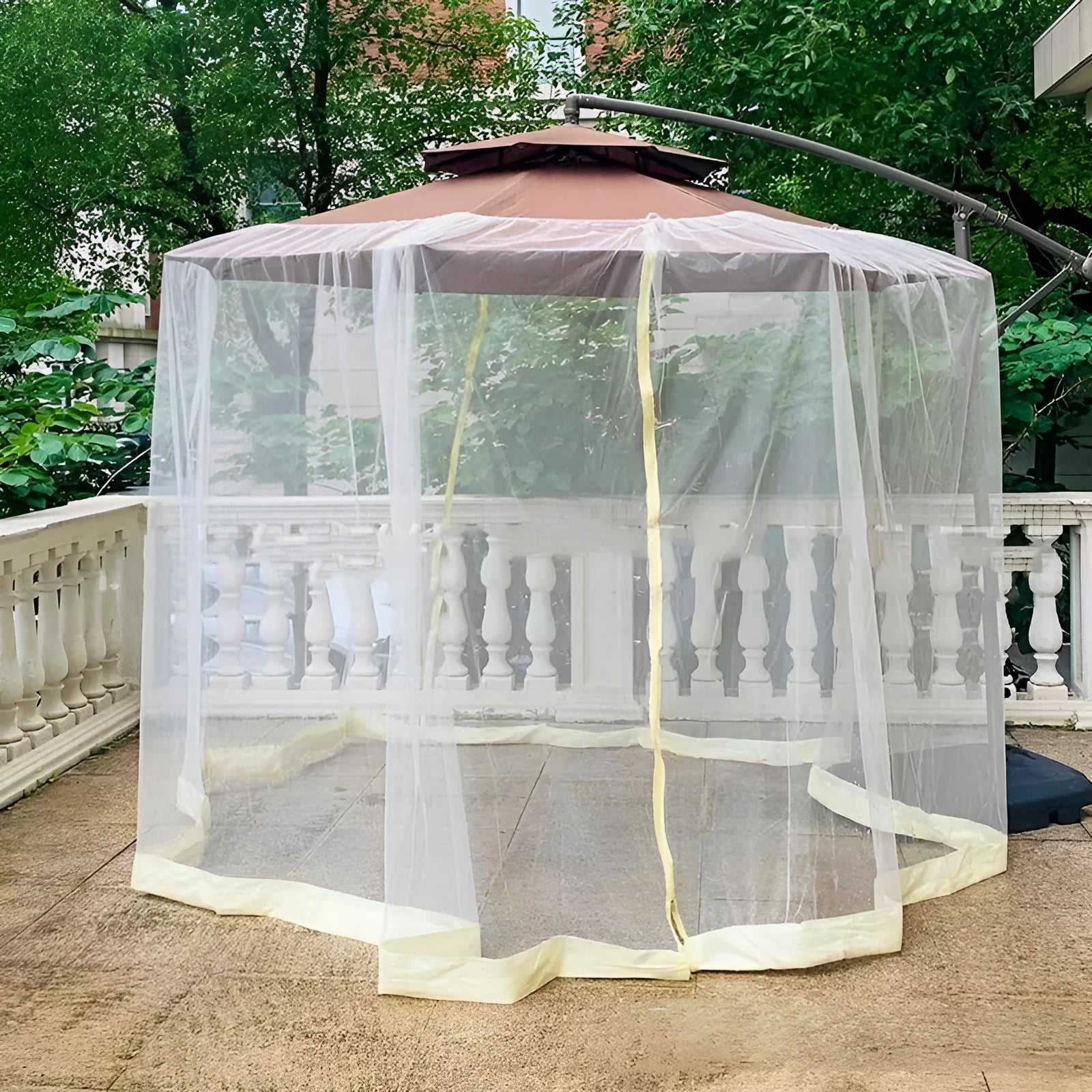 Heavy outdoor steel-framed umbrella tent with sunshade canopy and mosquito net in a garden setting.