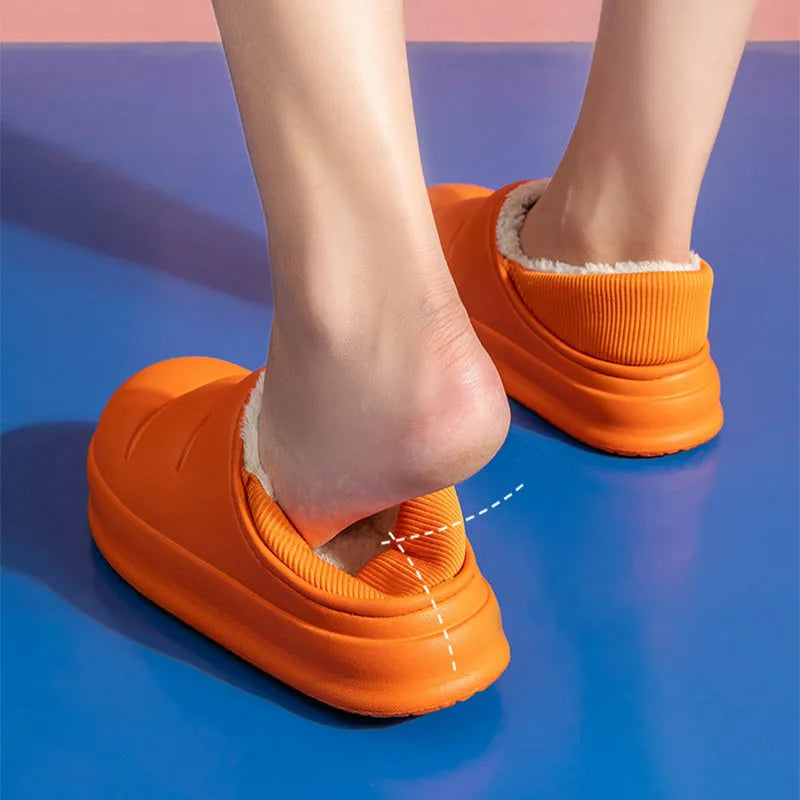 Green waterproof EVA cotton slipper with plush lining, flat sole, and hollow slip-on design.