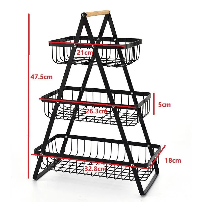 Black detachable iron double-layer fruit basket with a wooden carry handle on a tabletop.