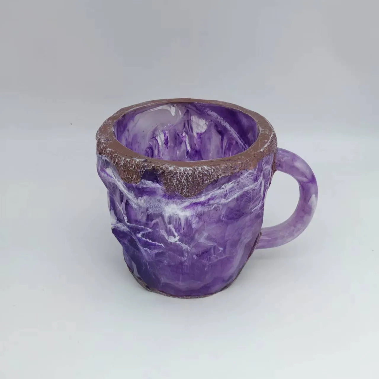 Purple resin coffee mug with handle showing crystal-like texture, 10cm tall.