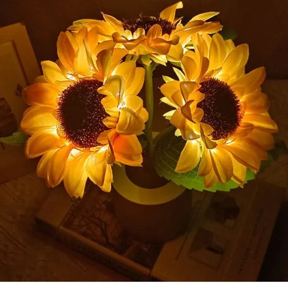 Rechargeable artificial sunflower LED night light on table with USB cable