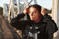 Fleece-lined hoodie sweater with smiley face print, regular fit, long sleeves, polyester fabric, available in black and pink