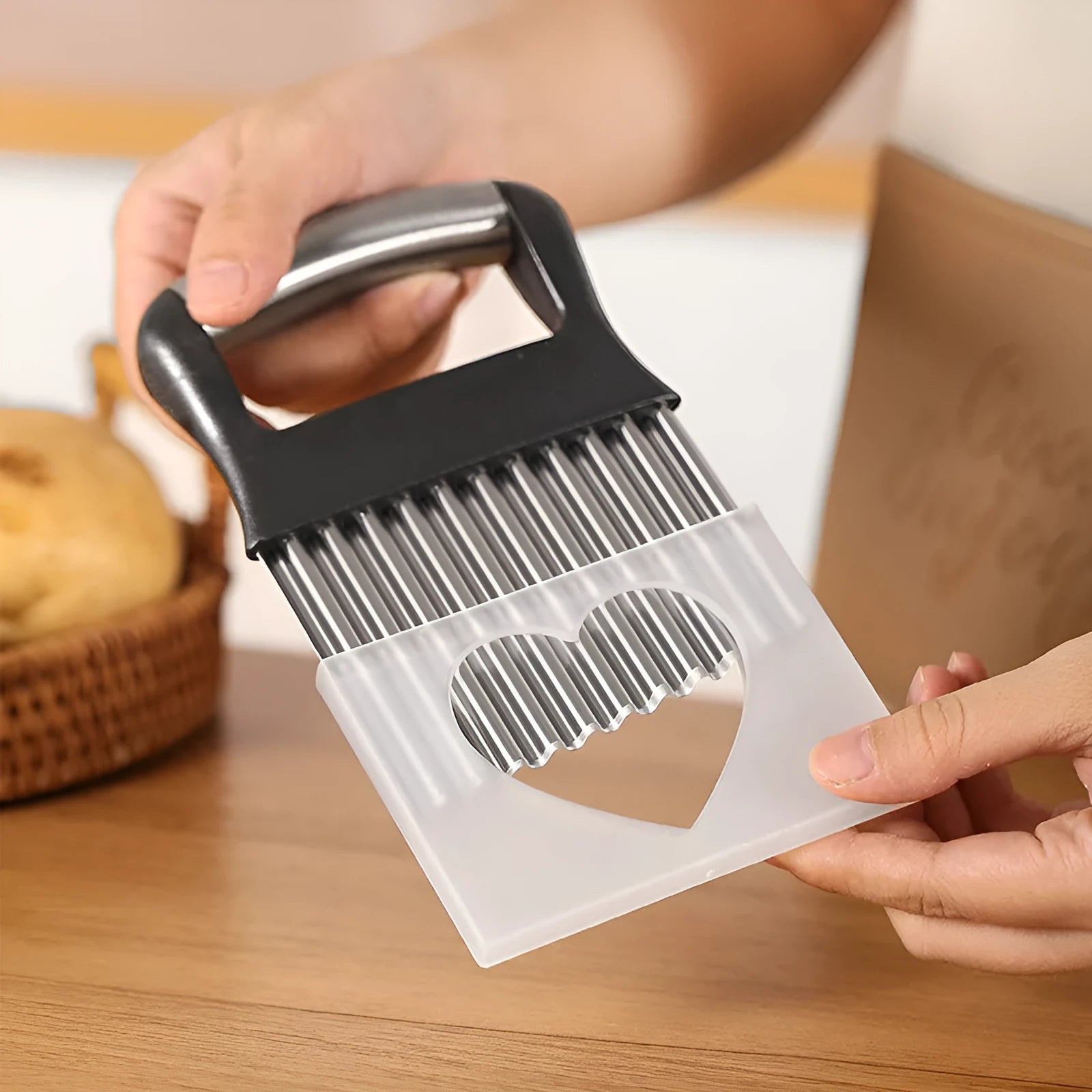 Stainless steel potato wave knife with corrugated blade on a wooden cutting board