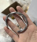 Men's white titanium steel pattern bracelet with geometric design on plain background