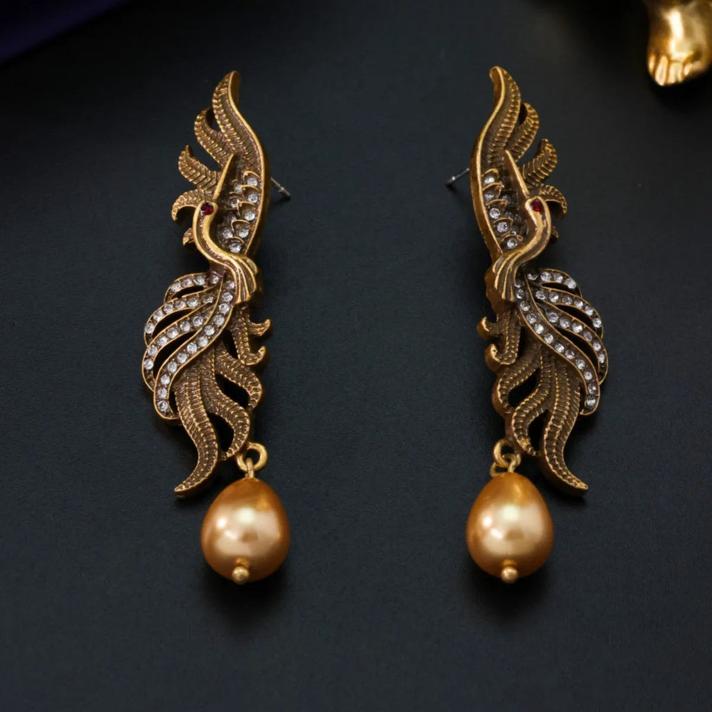 Pair of phoenix drop earrings in gold-tone electroplated alloy, hollow jeweled distressed design, 7cm by 1.6cm.